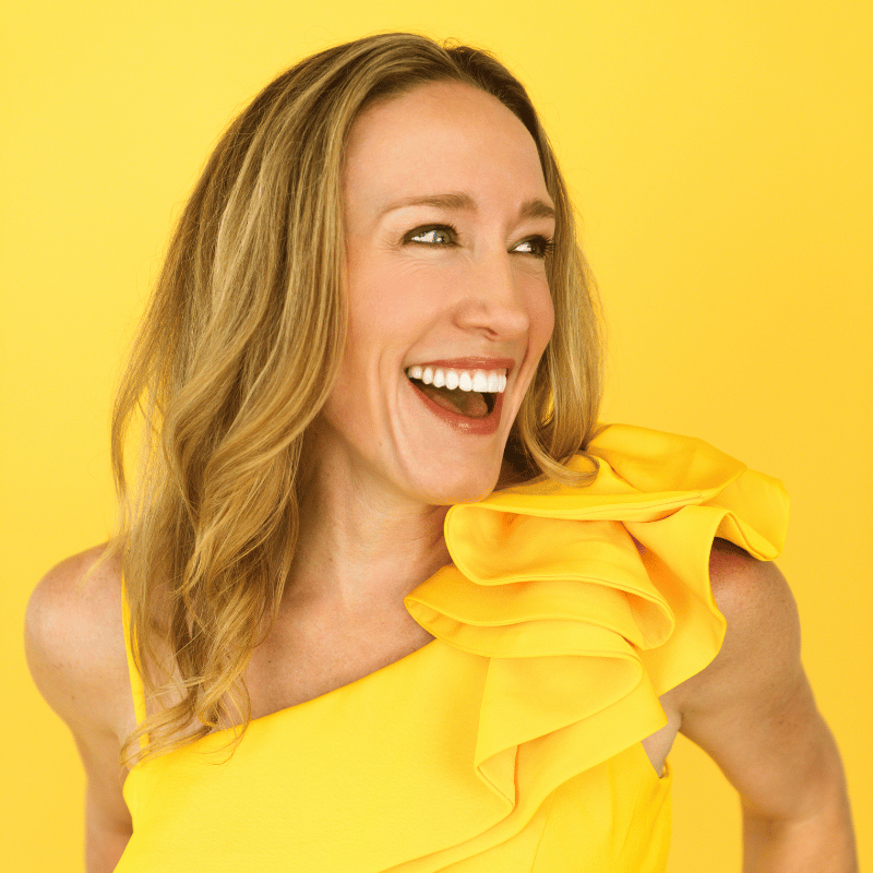 Headshot of Erin Stafford, woman with long, blond hair, in a yellow dress with a yellow background