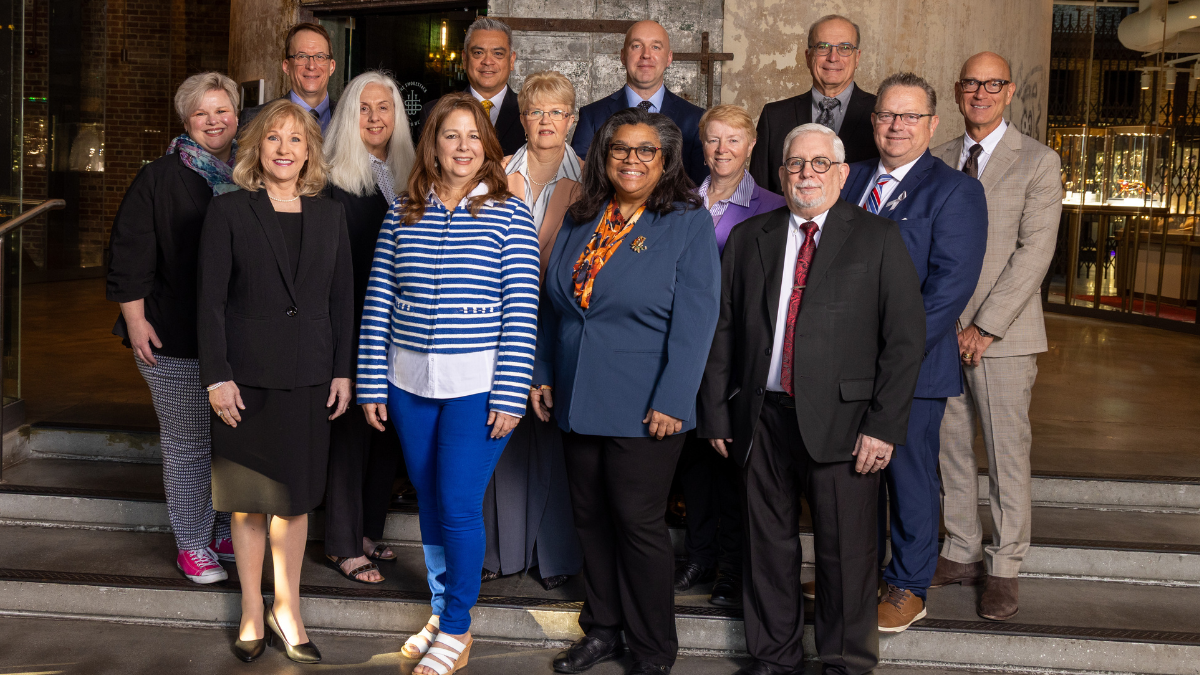 Image of the 2025-26 AMTA Board of Directors standing together on a staircase