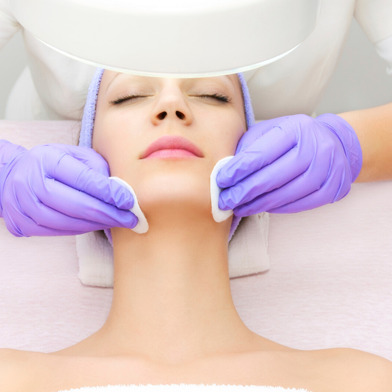 woman receiving facial skin treatment