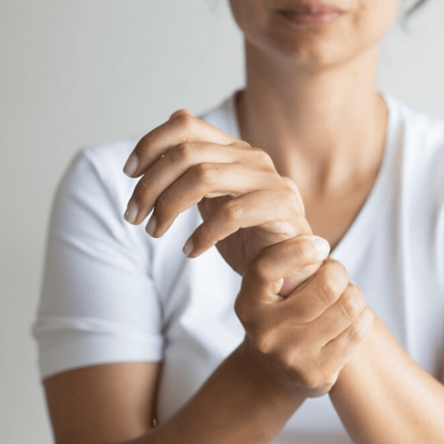 woman massaging wrist